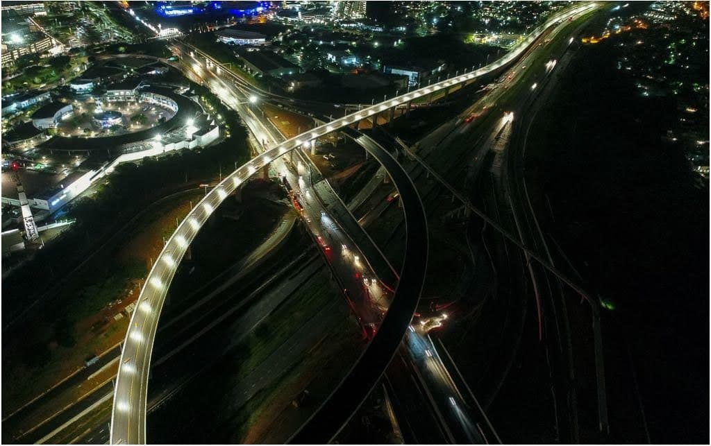 Night aerial view of the illuminated Mount Edgecombe Interchange flyover on the N2